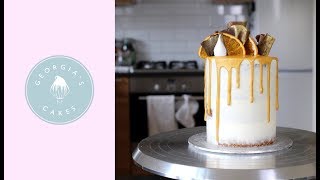 How To Make A Gold Drip Cake  Georgias Cakes [upl. by Ahsiugal802]